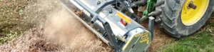 Stump grinder cutting a tree stump below ground level in a garden